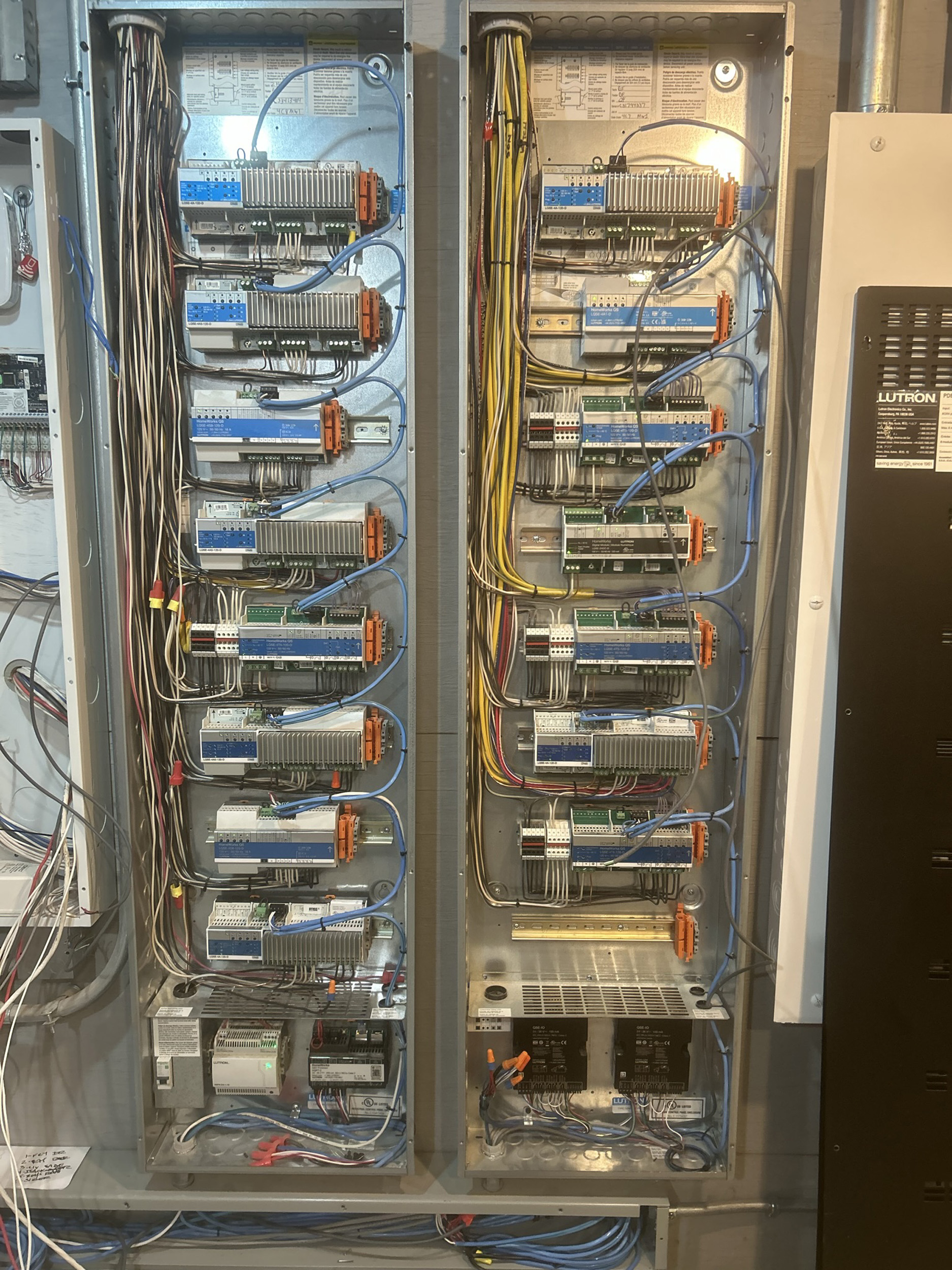 Josh AI Touch panel in a able with a traditional home in the background